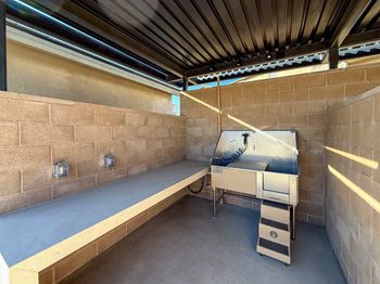 Outdoor space with dog wash station